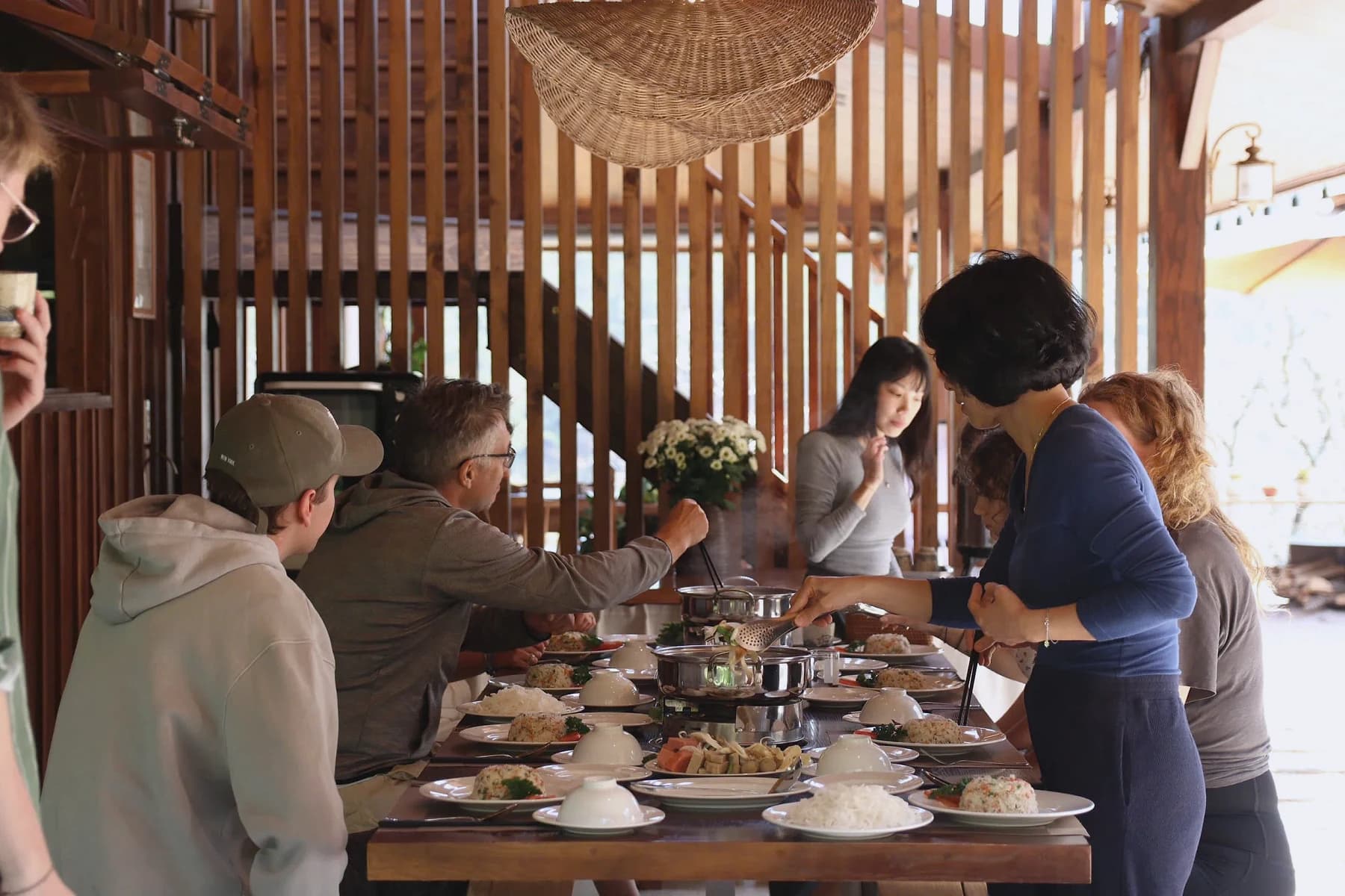 Participants share a communal meal at the Da Lat retreat.